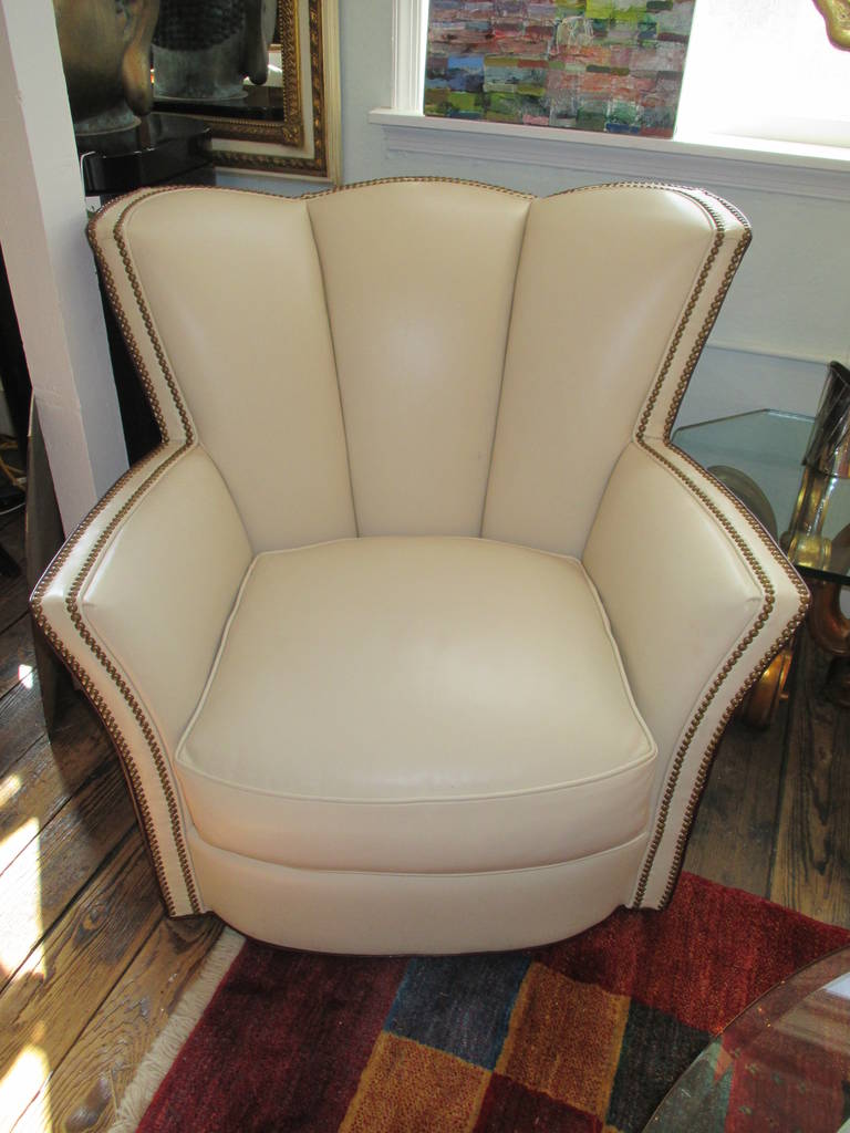 Super glamorous creamy white leather on the front, maroon/eggplant leather on the back, channel backs and schnazzy nailhead detailing on the front.   Art Deco tulip style shape.