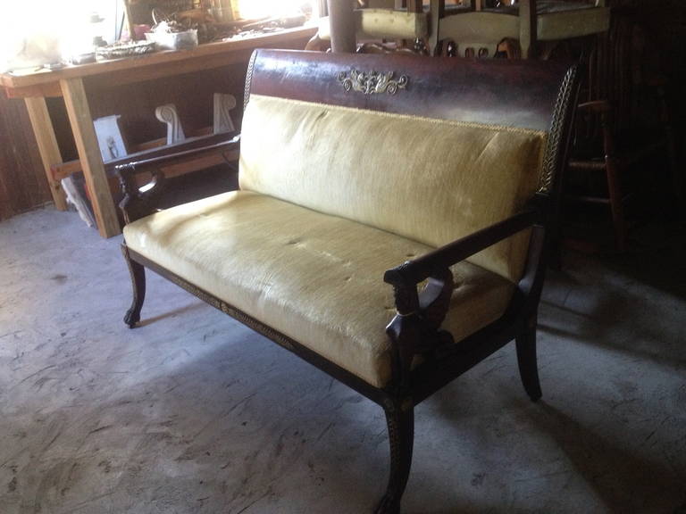 19th century French Empire loveseat with bronze trim.