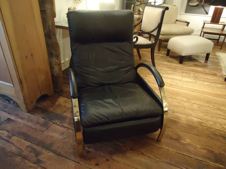 Probably the most elegant recliner we've seen, sleek midcentury lines, black leather with curvy chrome arms.
When extended, 54