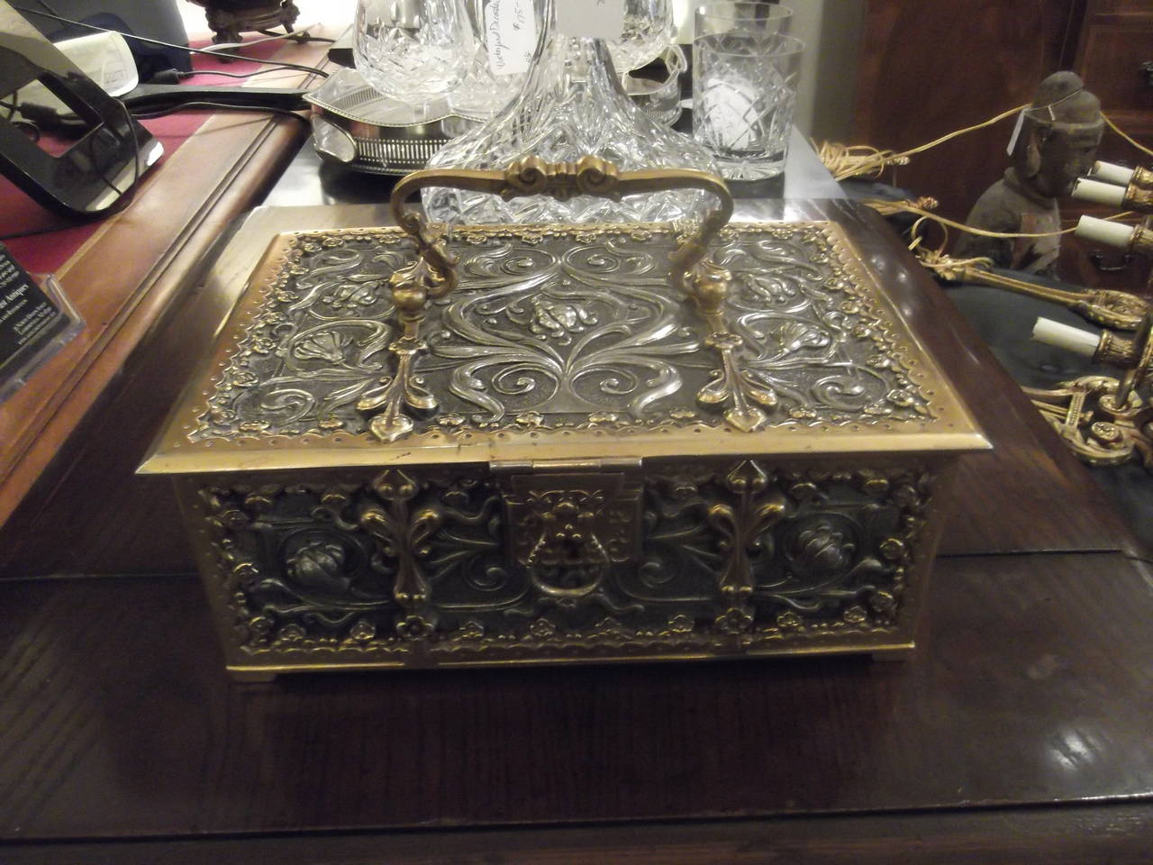 Highly decorative, elaborate cast bronze and silvered hinged table box. Wood lined which  suggests it was designed for cigars or pipes.  Hallmarked with a Lion and the letter 