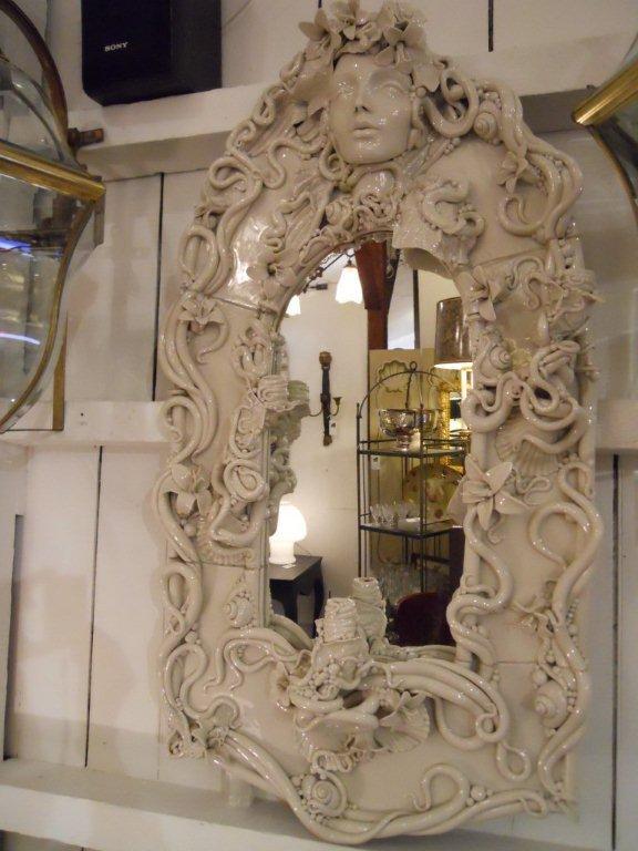 Handmade Italian mirror
3 candleholders
Velvet backed
2 ft. W x 43