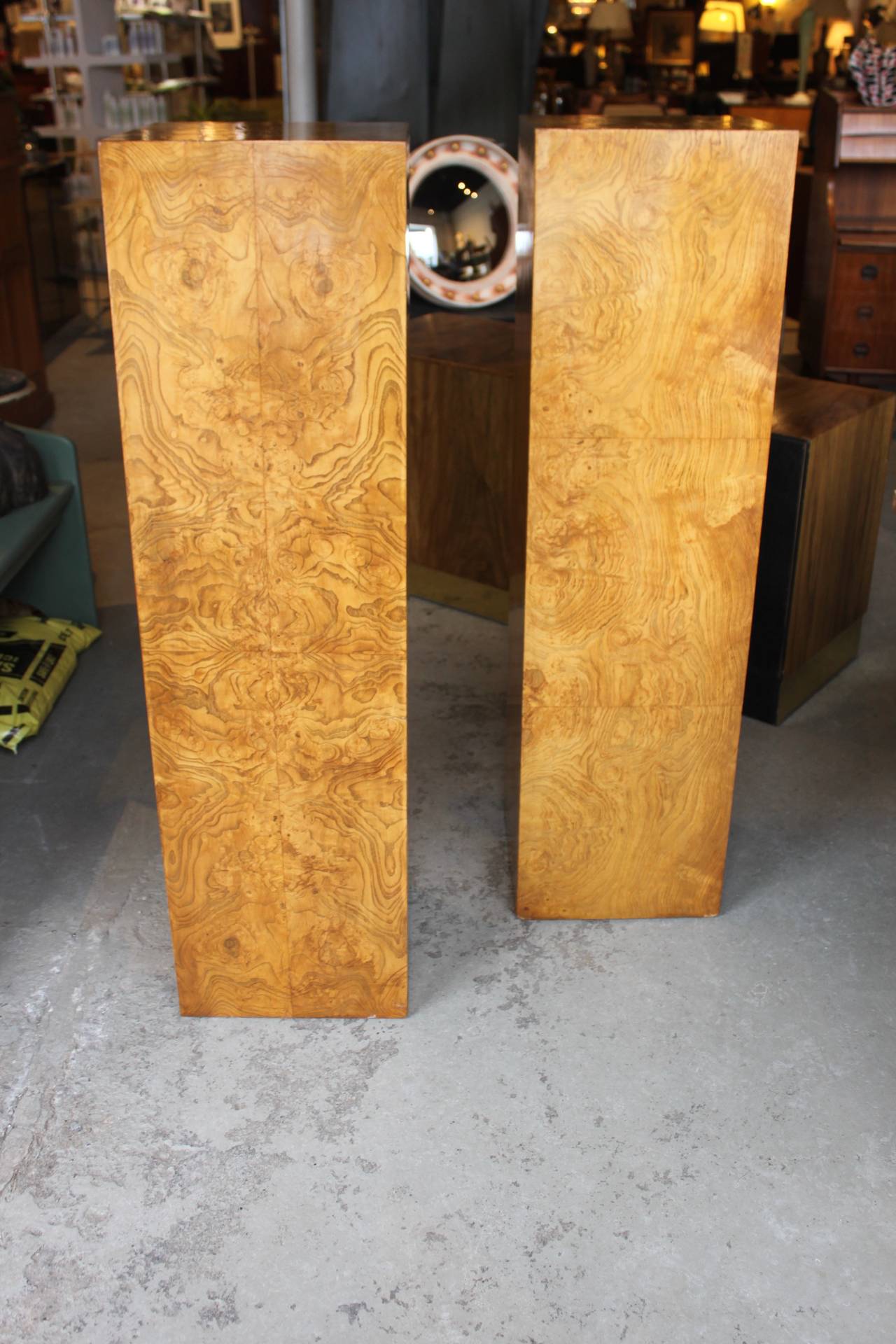 Tall burl wood pedestals in the style of Milo Baughman.  Beautiful vintage condition.