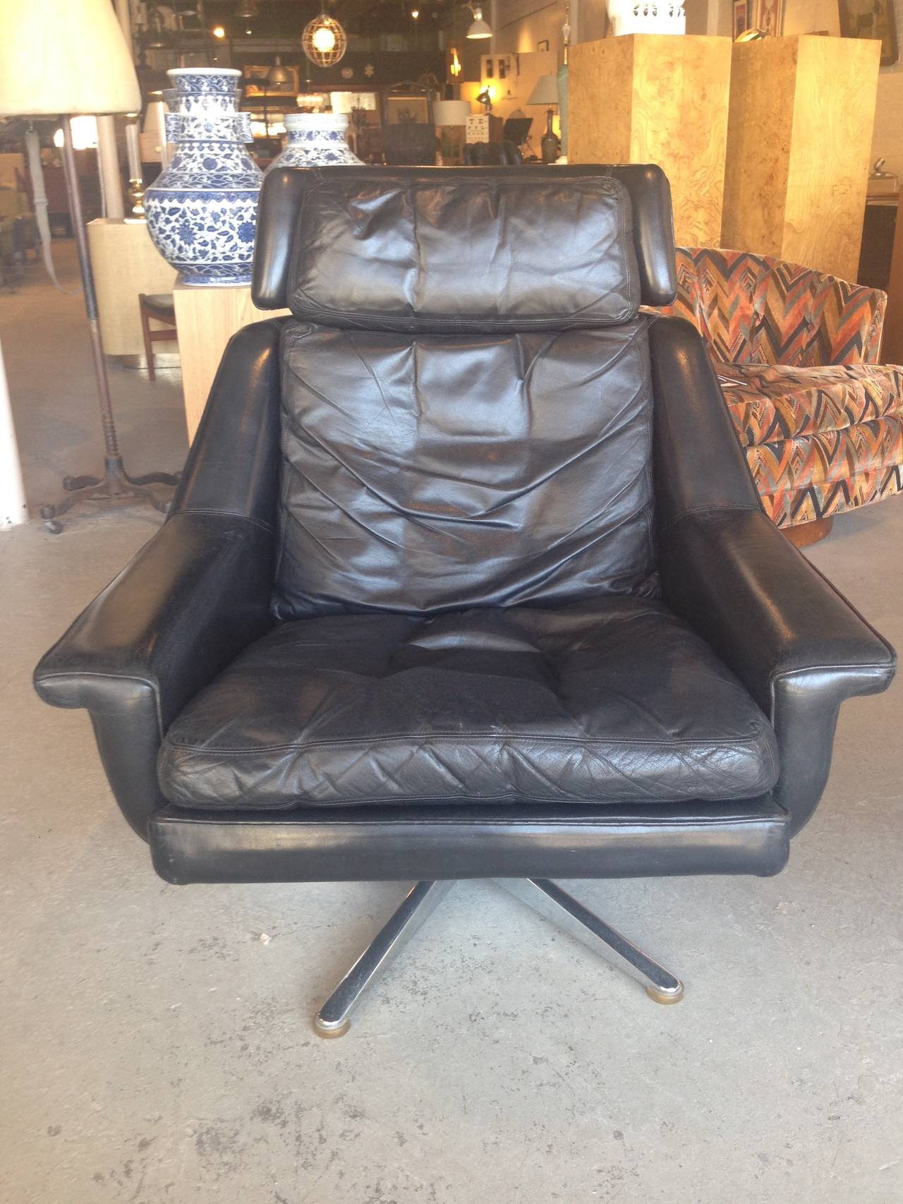 Down cushions. Leather in good shape. Some scuffs here and there but overall in excellent vintage condition. Lounge chair #802. Designed by Werner Langenfeld.