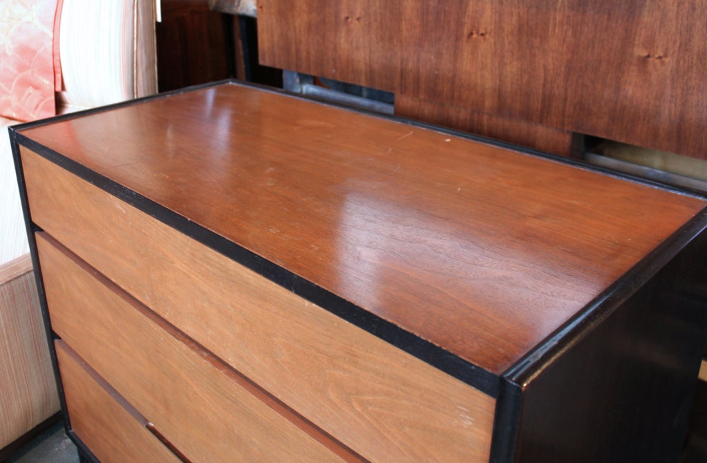 Mid-Century Ed Wormley design for Dunbar. Three-drawer chest with walnut top and drawer fronts and ebonized case.