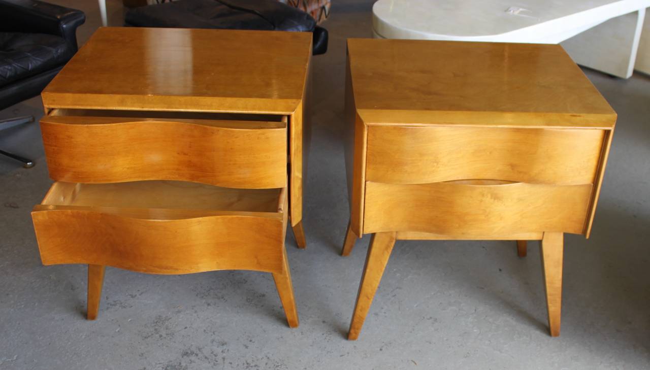 Pair of Edmund Spence wave front night stands.