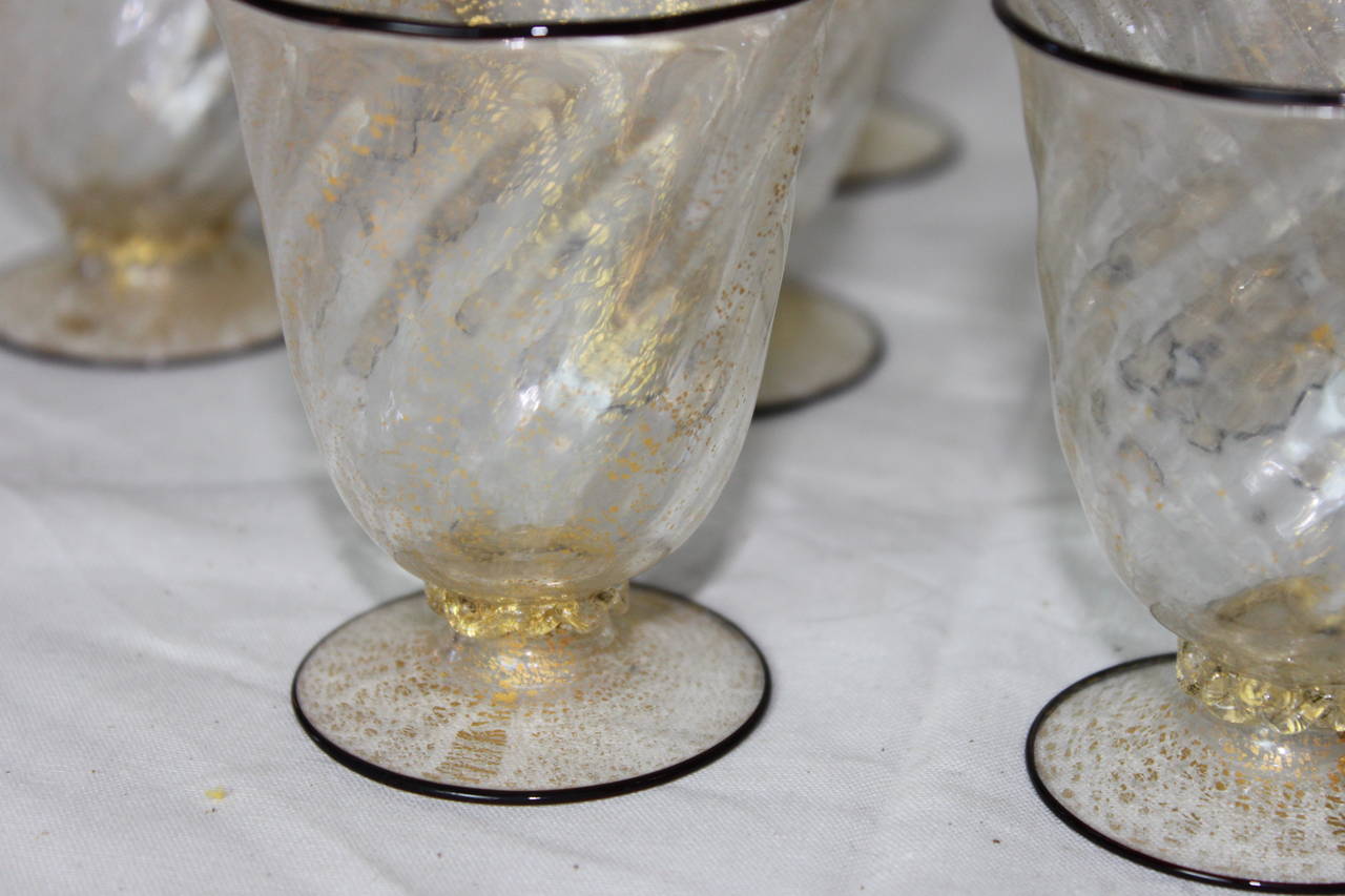 Gorgeous antique Venetian glass cordial glasses. Black rims, gold leaf flakes, swirl pattern. All handmade. Set of ten glasses.