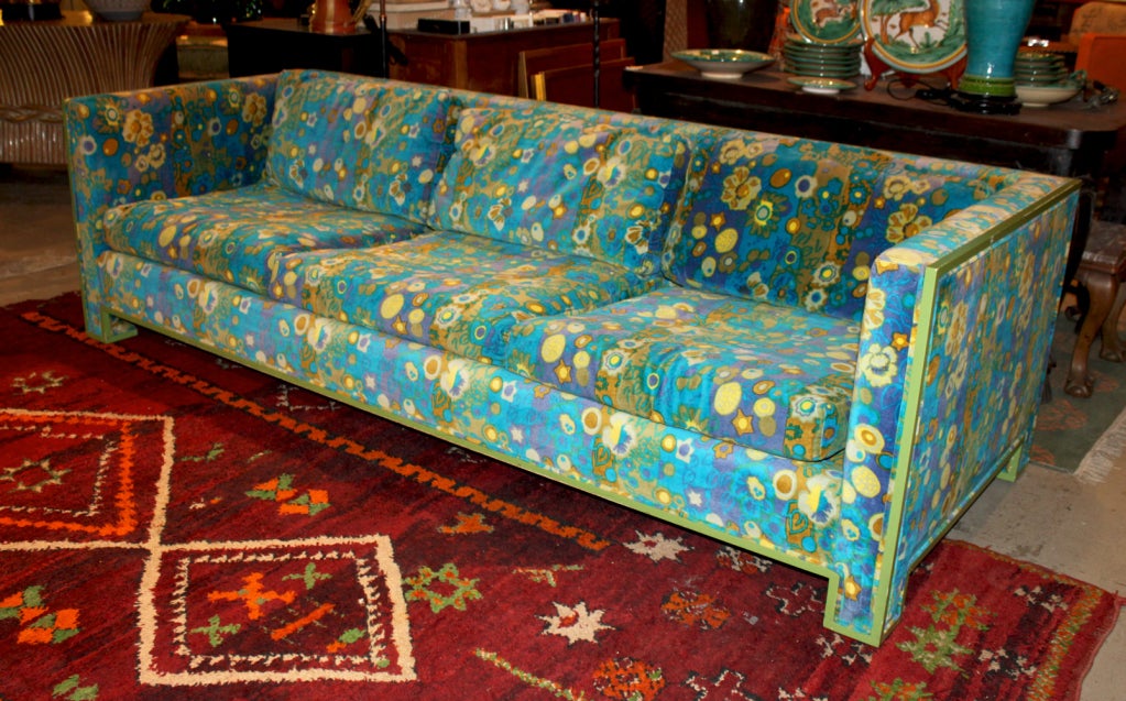 1950's sofa re-upholstered in late 1960's in a Jack Lenor Larsen fabric, titled 'Carousel Oceantide.'Green painted wood trim framing entire sofa. matching club chair also available.