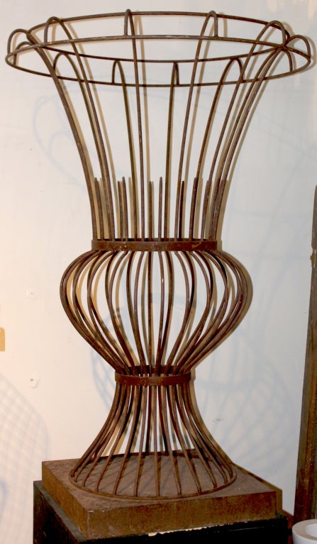 Beautiful iron topiary frame in the shape of an urn. A classic sculptural shape on its own.