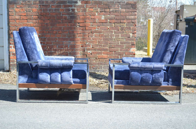 Pair of vintage Baughman style lounge chairs in original blue velver fabric.  Padded arms with walnut wood trim.