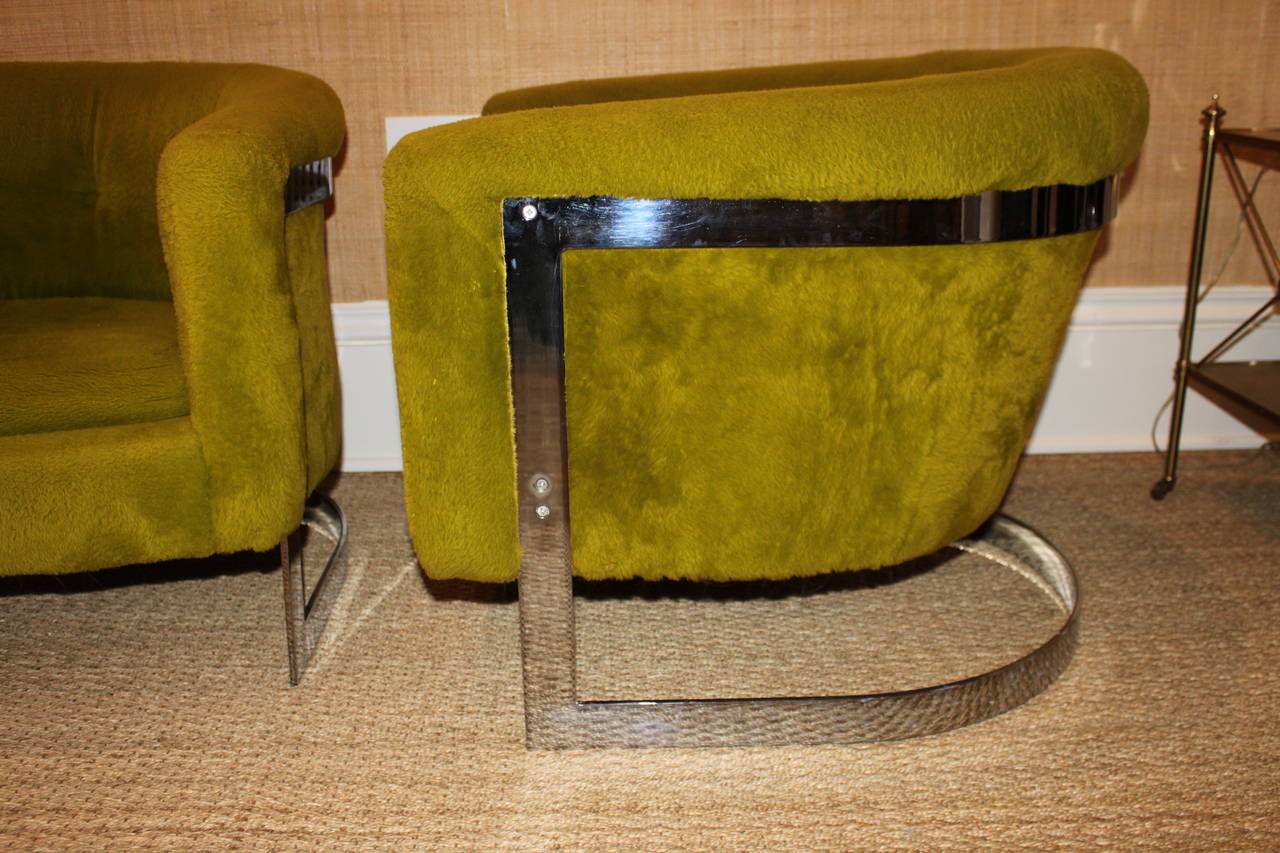 Original fabric.  Pair of Milo Baughman chrome cantilevered lounge chairs.  In vintage green fabric. Seat cushions soft. Excellent vintage condition.