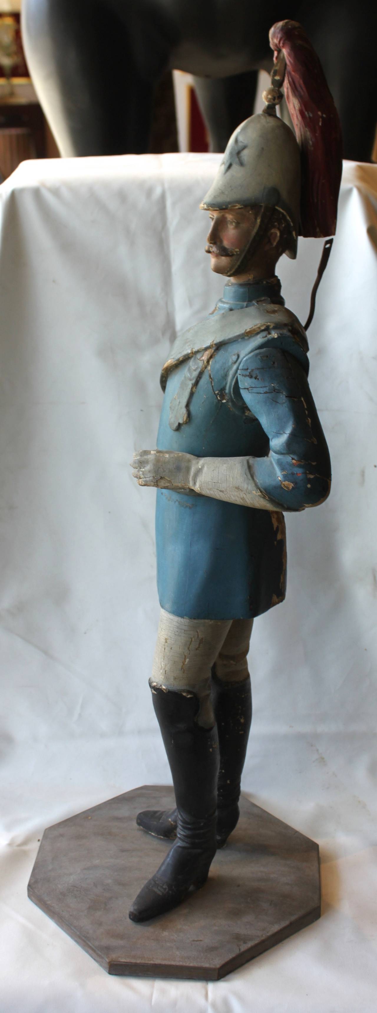 Polychrome carved wood European soldier figure,
circa 1825-1835
Original paint
Articulated arm
from carousel band organ.