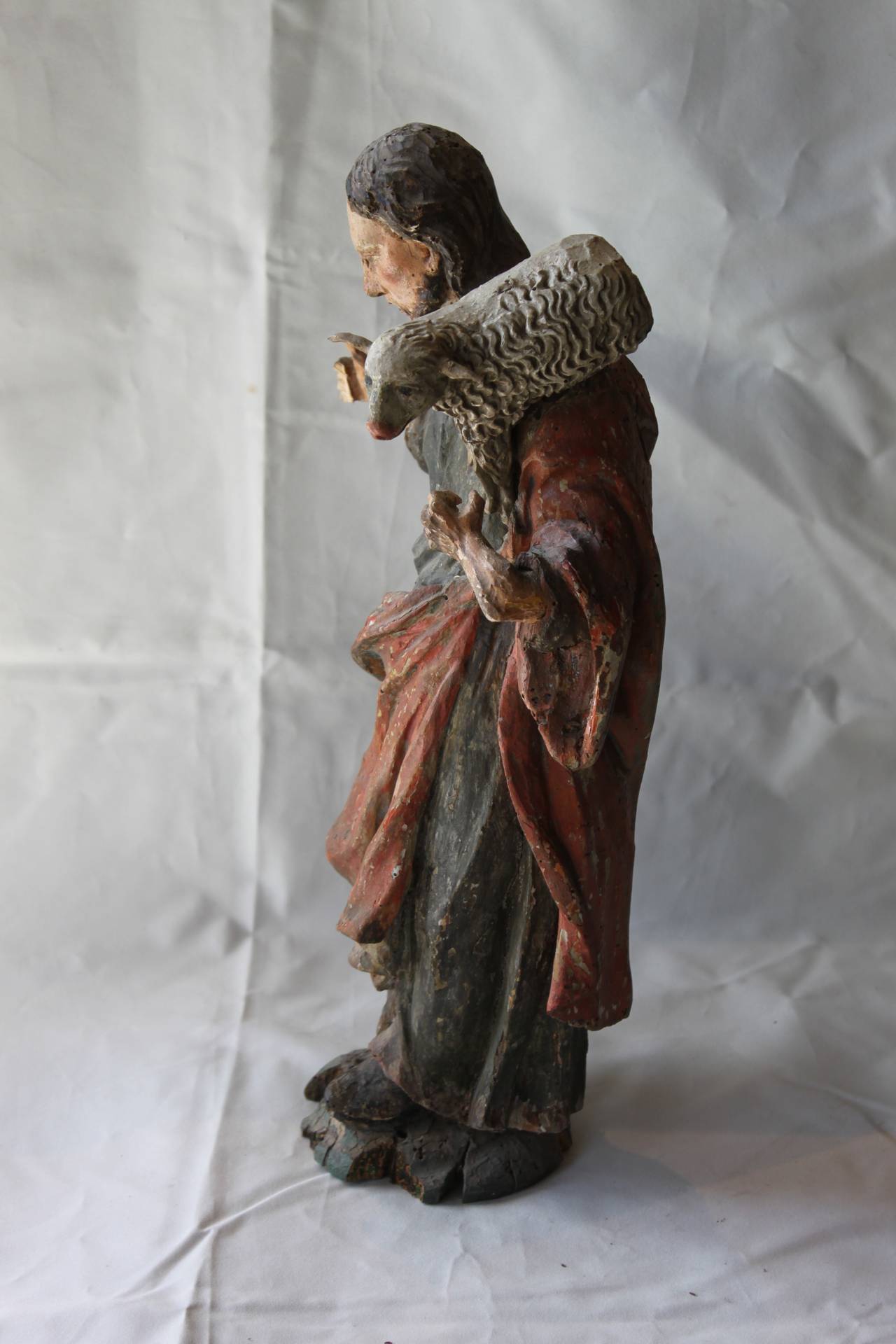 Carved polychrome saint with lamb
Late 18th-19th century
Lamb loose
Missing staff.