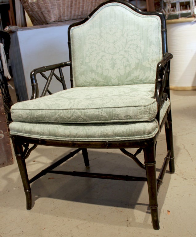 Set of 4 Black lacquer, faux bamboo arm chairs with upholstered seats and backs. Attributed to McGuire