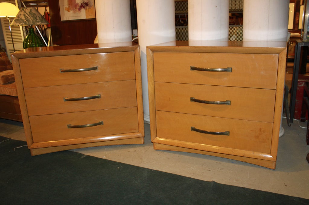 Pair of Widdicomb, Modern Originals, 3-drawer bachelor chests by T.H. Robsjohn-Gibbings. Bleached and glazed walnut cabinets with ogee molding framing 3 large flat front drawers with large scale brass pulls sitting on a concave pediment. chests sit