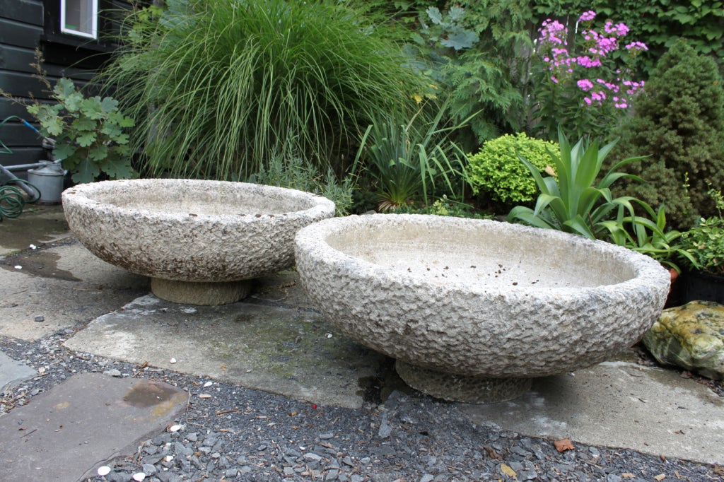 Pair of hewn stone garden basins with tapering sides on raised circular foot. Drilled.

Ex collection Peter Marino, Sothebys Amsterdam

Note: stone basins are off-location (not in the store) please call ahead to schedule a viewing.