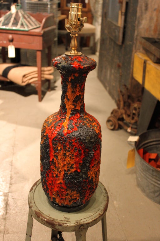 Great 1970's lamp with gorgeous drip glaze over a textured matte glaze, reminiscent of igneous rock.