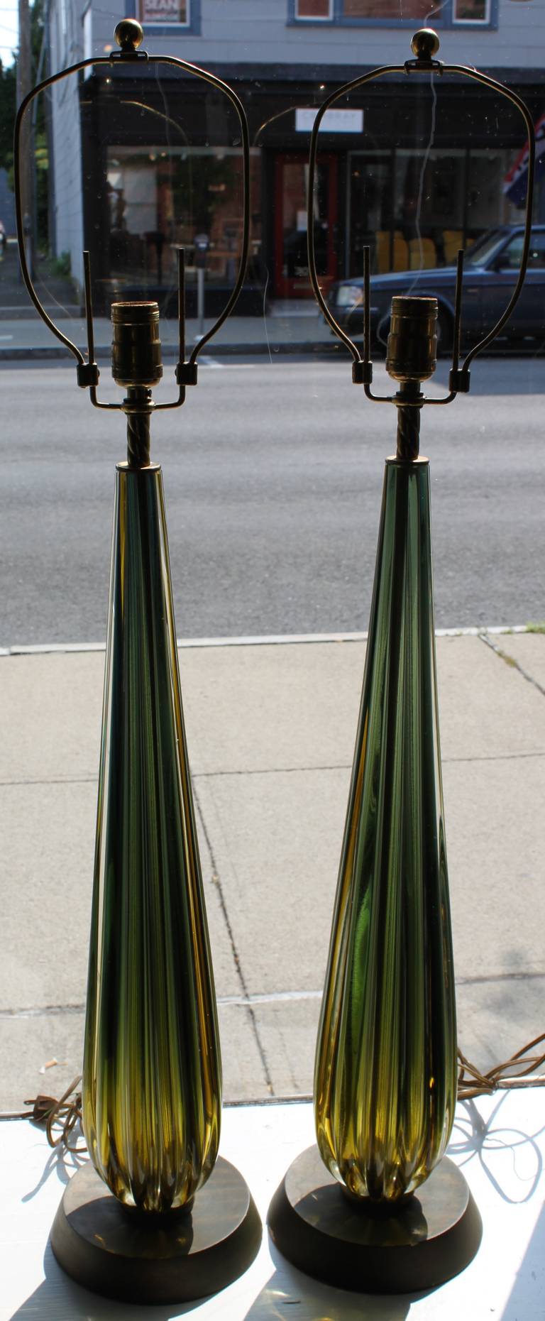 Pair of luminous solid, pulled Murano glass lamps. Camer label attached to one lamp.