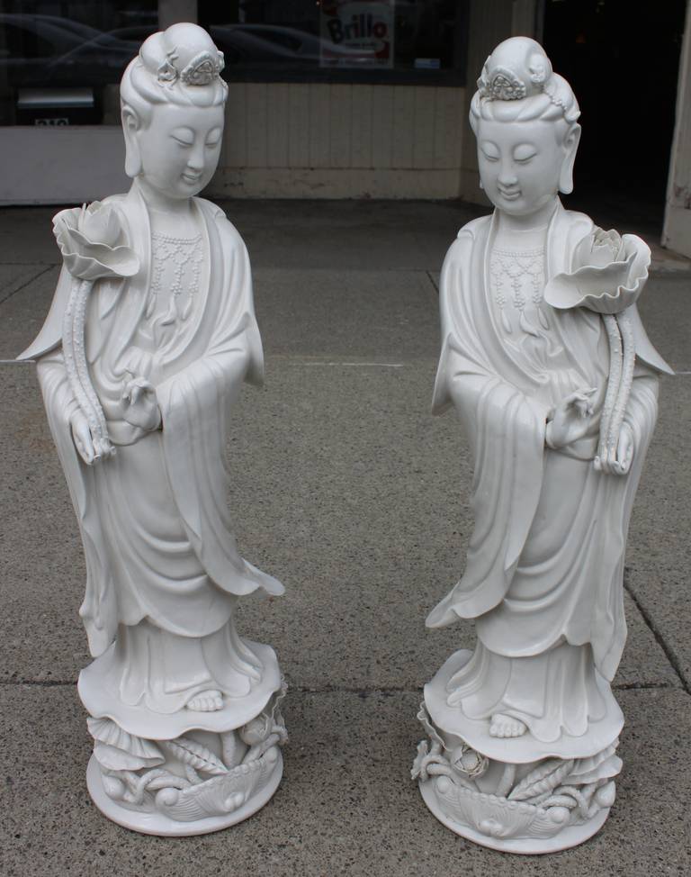 Rare and exceptional complimentary pair of standing Quan Ying statues. Beautiful delicate. We believe one is older than the other.  The newer one is stamped 