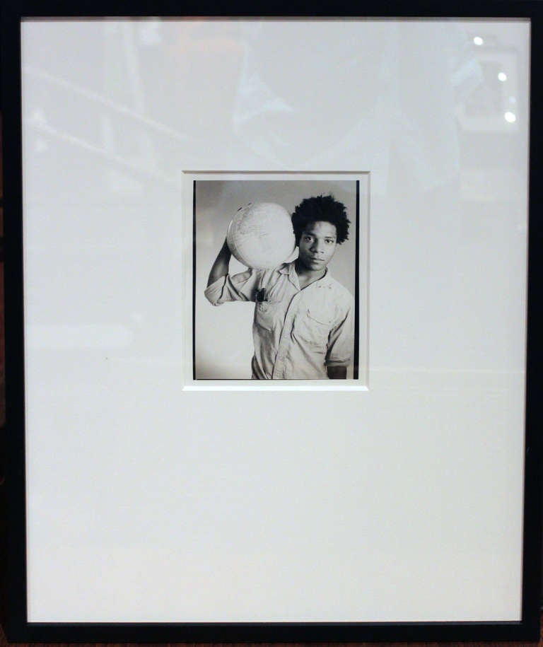 Black and white photograph of Jean Michel  Basquiat by photographer Christopher Makos. Signed and titled on verso

Frame size 17