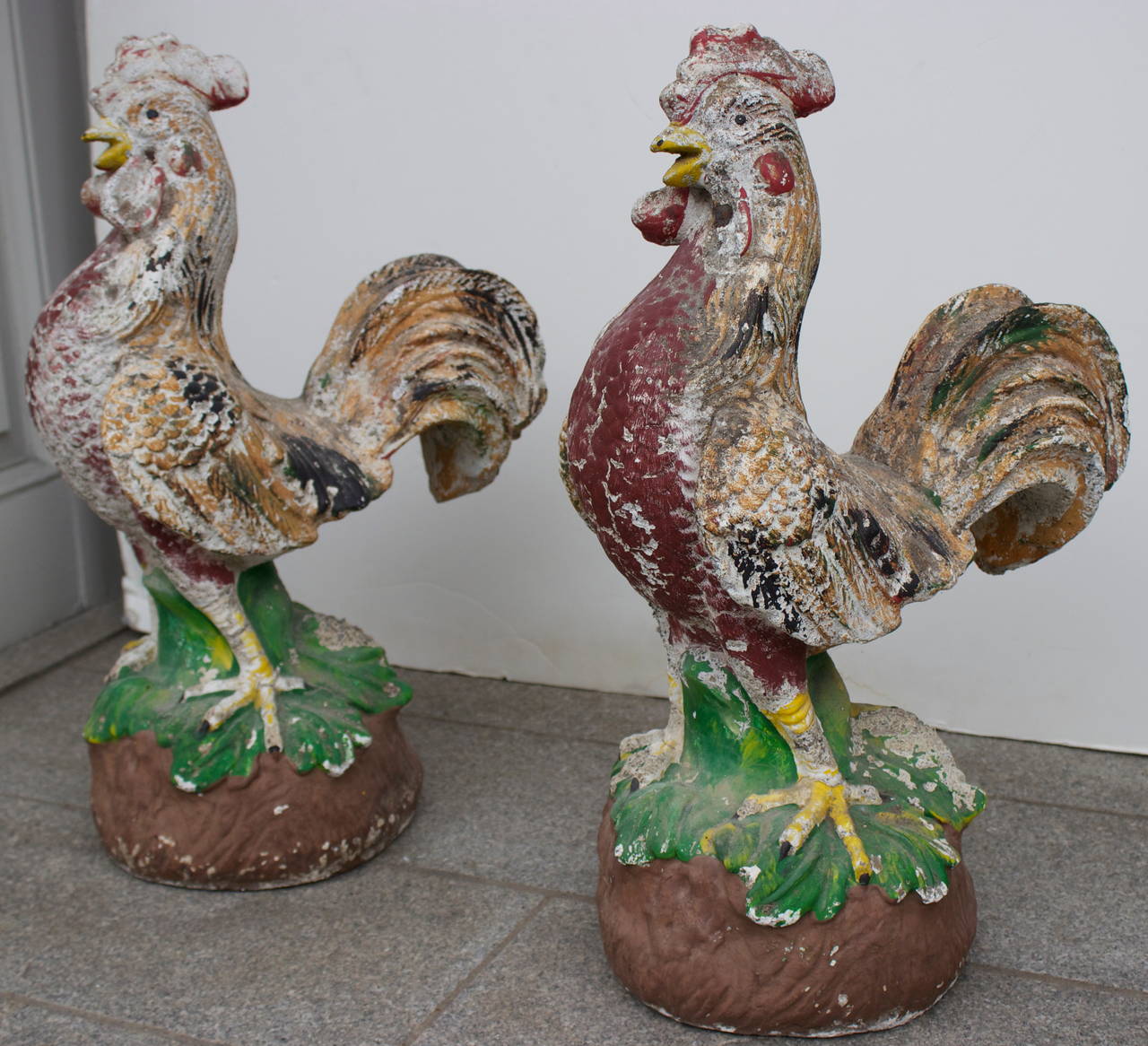 Wonderful pair of painted cement roosters from France. Great patina.