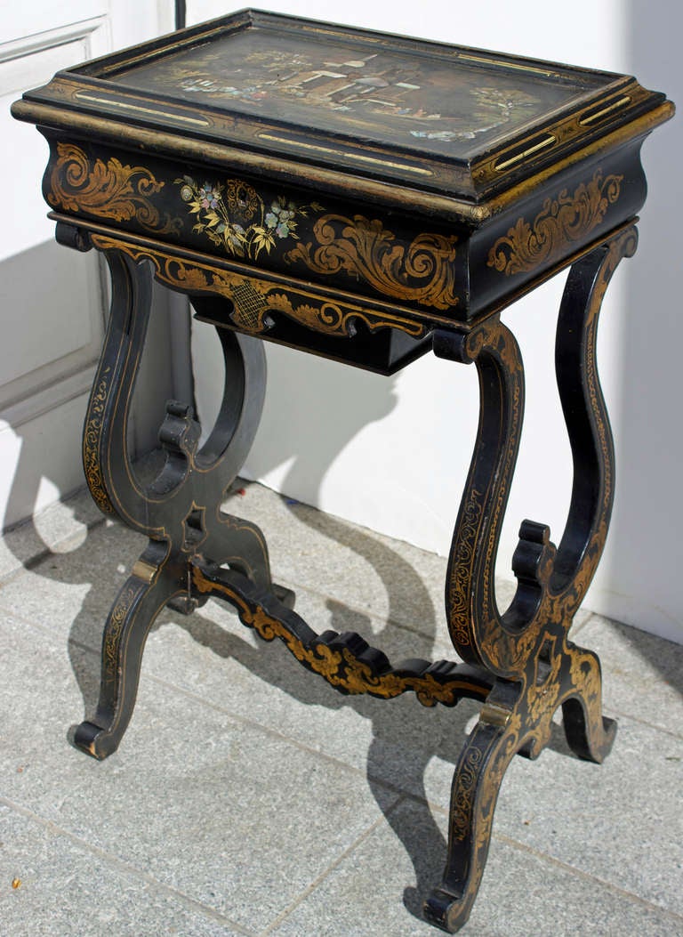 Napoleon III period lacquered and hand painted ladies work table. Ebonized lacquered wood with polychromatic flowers 