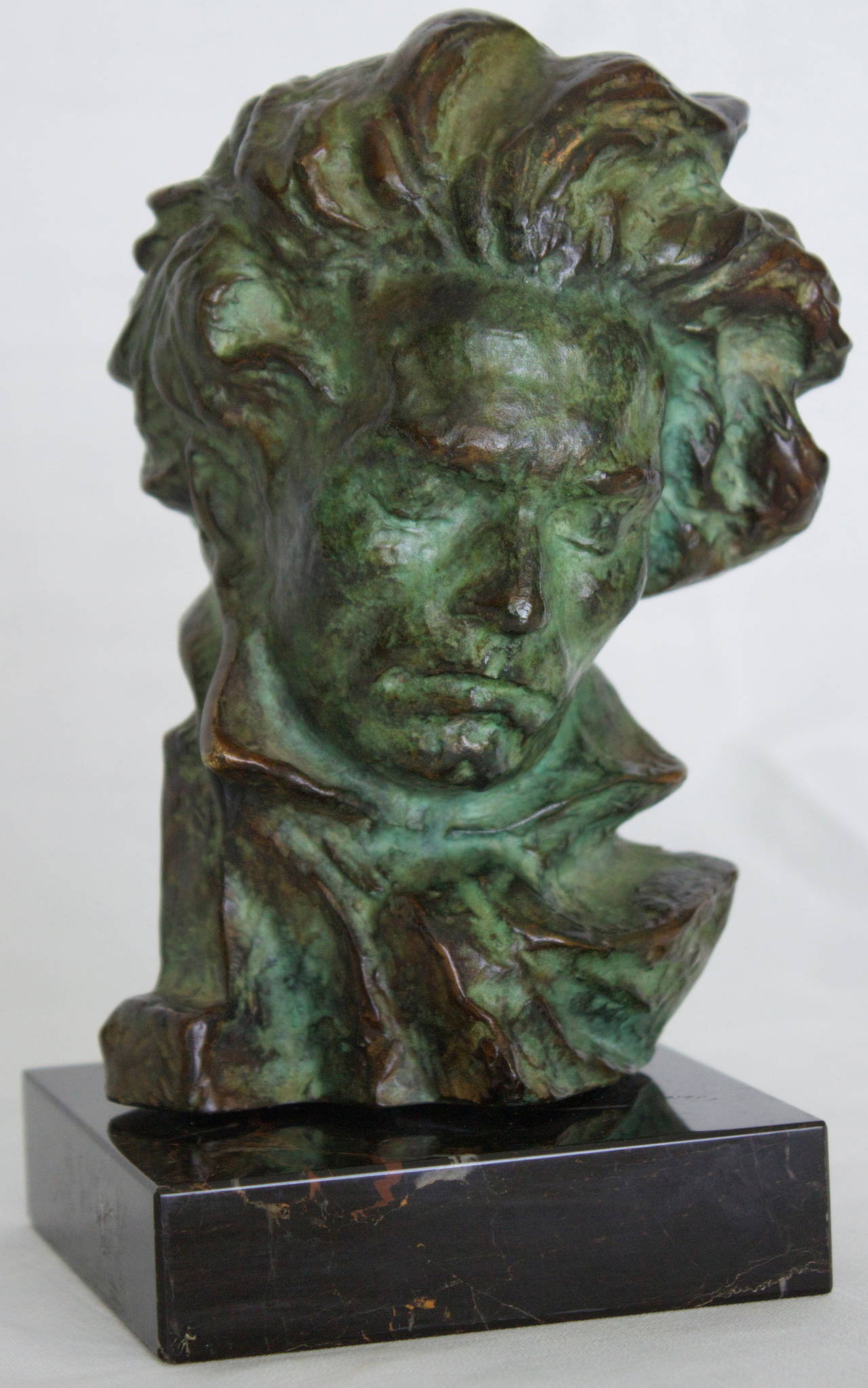 Superb shaded green patina bronze sculpture of the Head of Beethoven on a portor marble plinth.The work was cast by Max Le Verrier  foundry.Signed into the bronze 