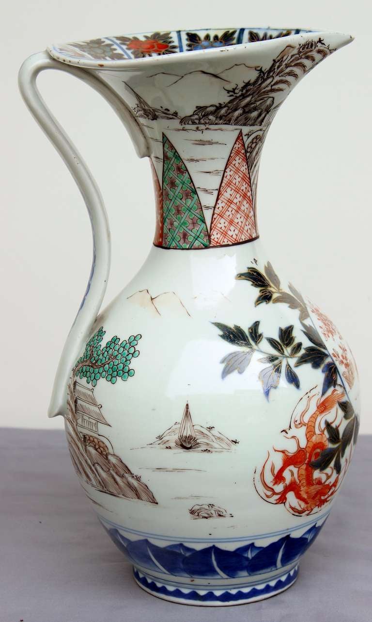 This delightful porcelain jug has been made specially for Europe. Front register shows two birds surrounded by tree in flowers, bordered on each side by underglazed 