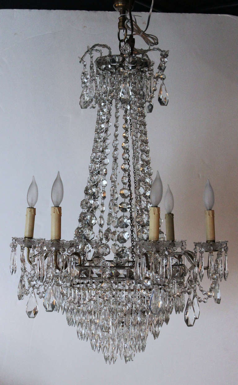 This gorgeous Chandelier from the 1920's get its name from the shimmering of faceted crystals sprays running down to the basin.
Its 