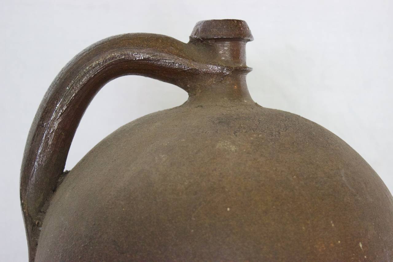 This stoneware Jar was handmade in Ger, a village in the heart of Normandy, famous for its stoneware clay craftsman from 18th century till 1920. Stoneware is not porous and therefore can be used for liquor storage such as 
