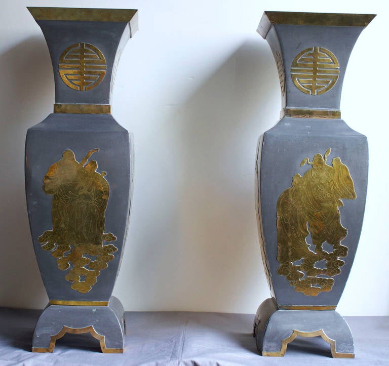These pewter vases have incised brass decoration. They are stamped 