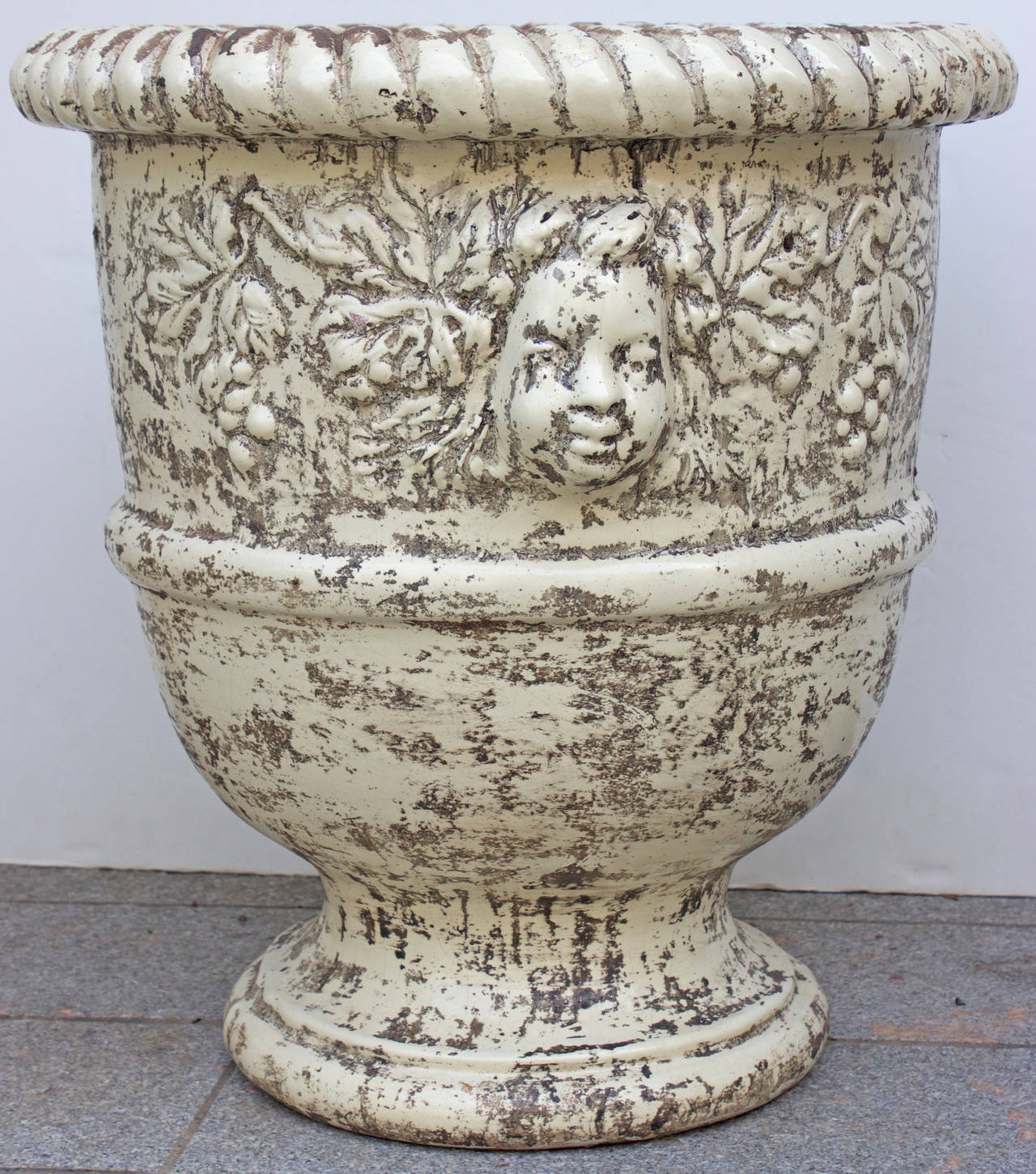 A beautiful anduze style urn, this gorgeous ceramic French Classic planter recreates the level of the 16th century French originals with medaillons and foliages details. It is Classic and timeless.
France, circa 1990.
After modelling and stamping