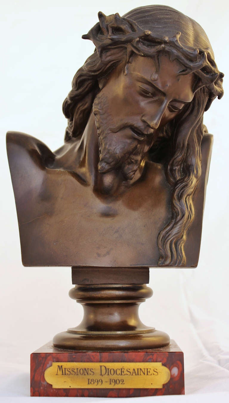Marvellous Christ bust in a brown patina bronze resting on a marble base, after a model by Jean-Baptiste Clesinger (French 1814-1883). Its name is marked on the side of the right shoulder.
The bronze was made by Ferdinand Barbedienne (French