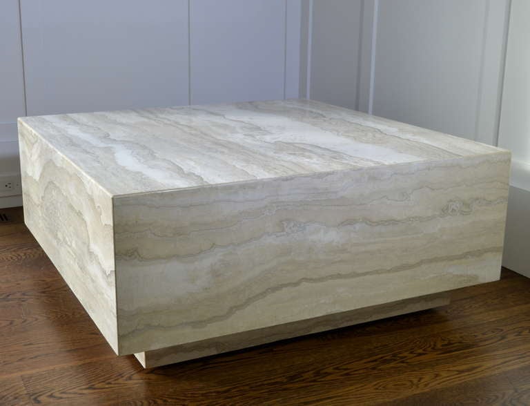 Super quality 1970s cocktail table made of travertine marble, very slightly elevated over sturdy casters. Substantial and elegant --with beautifully color striation.
