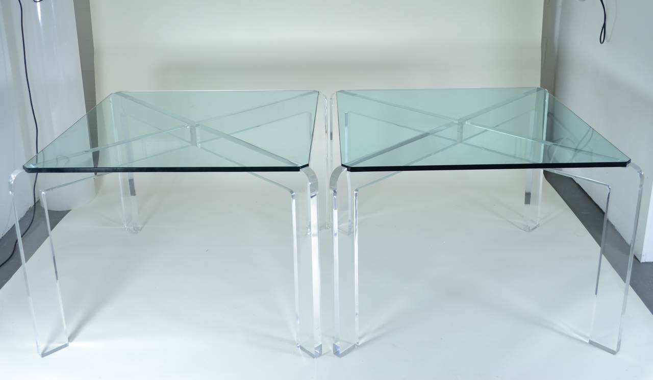 Unusual pair, constructed of heavy Lucite with 3/4 glass tops notched to fit into base. Great size and presence.