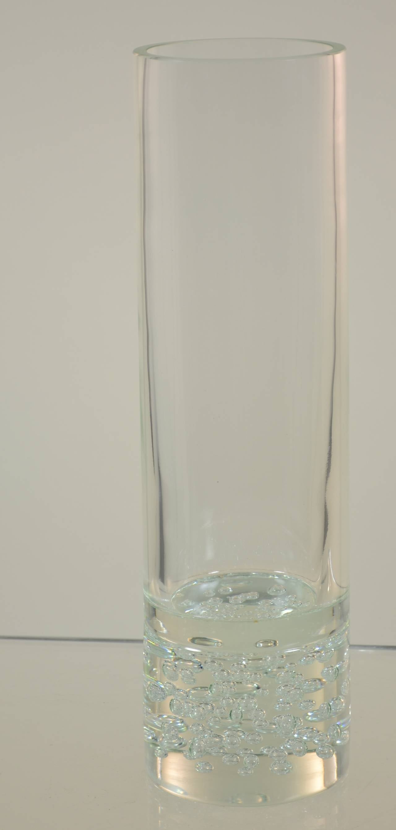 Beautiful Murano clear glass vase with heavy solid base. Bubble decoration within solid base. Signed Des. L. Seguso.