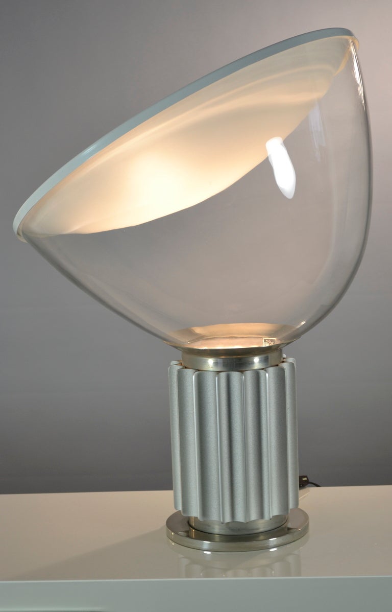 Iconic Taccia lamp designed by Achille Castiglioni in 1959, and produced by Flos since 1962. Achille Castiglioni said about the Taccia lamp in a 1970 interview: 