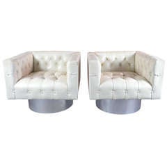 Pair of Tufted Leather Swivel Lounge Chairs