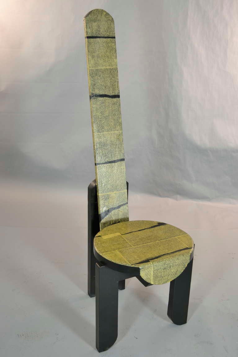 Dramatic, sculptural chair with distinctive form and decoupage decoration.