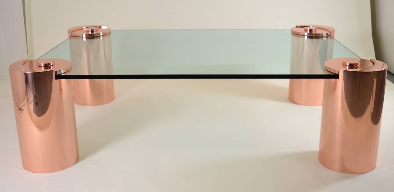 Unusual copper finished Karl Springer cocktail table. Authenticated by former Director of Design of Springer, Ltd. Signature cylinders in 10