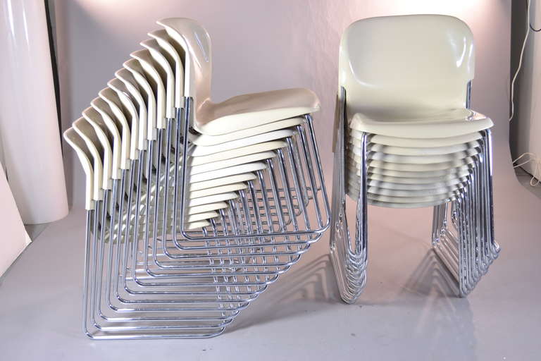 Produced in the USA under license from Drabert in West Germany for Atelier International Ltd.  A set of 23 chair in ecru color polymide seats on quality chrome legs. Generally excellent condition. Very slight fading on some chairs. Set of 23 is