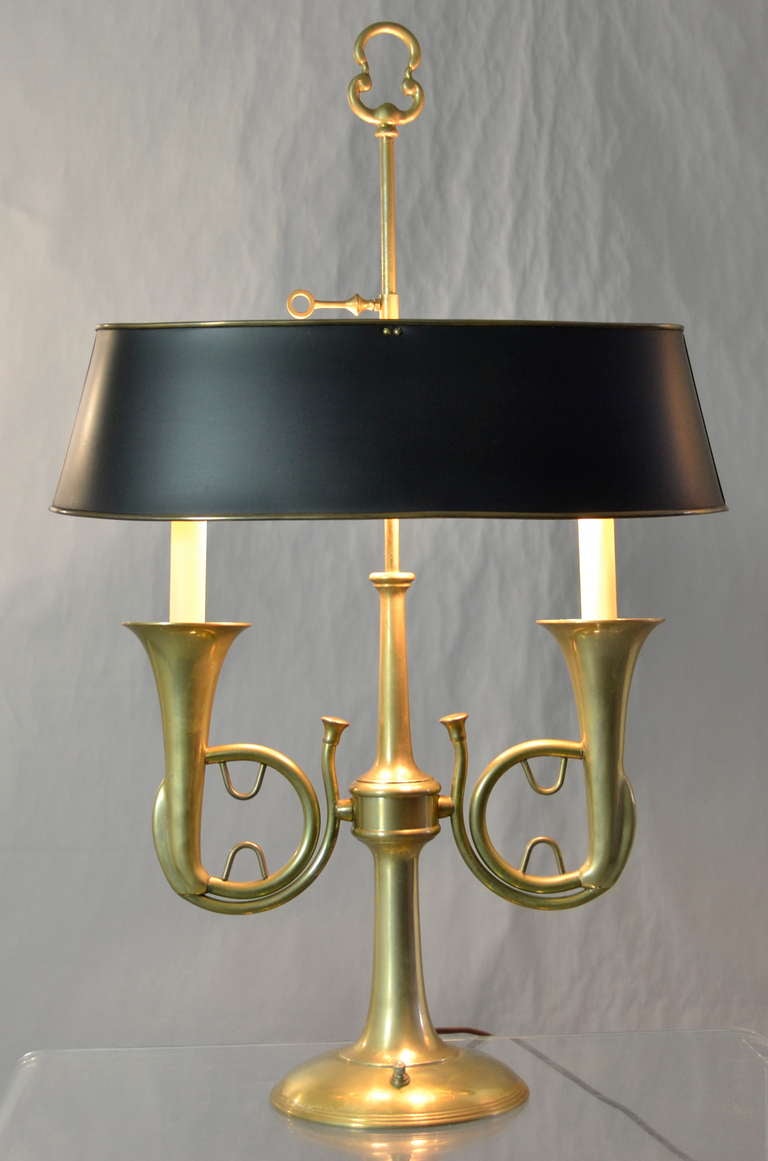 With a brass lined tole shade and a double horn design, this lamp has two small candle bulbs as well as a two standard bulb lamp head. Switch allows low candle bulbs only, standard bulbs only, both together, and all off.