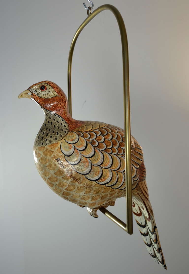 Large paper mache (partridge?) on brass swing. Beautifully hand painted and signed by noted Mexican artist Sergio Bustamante.