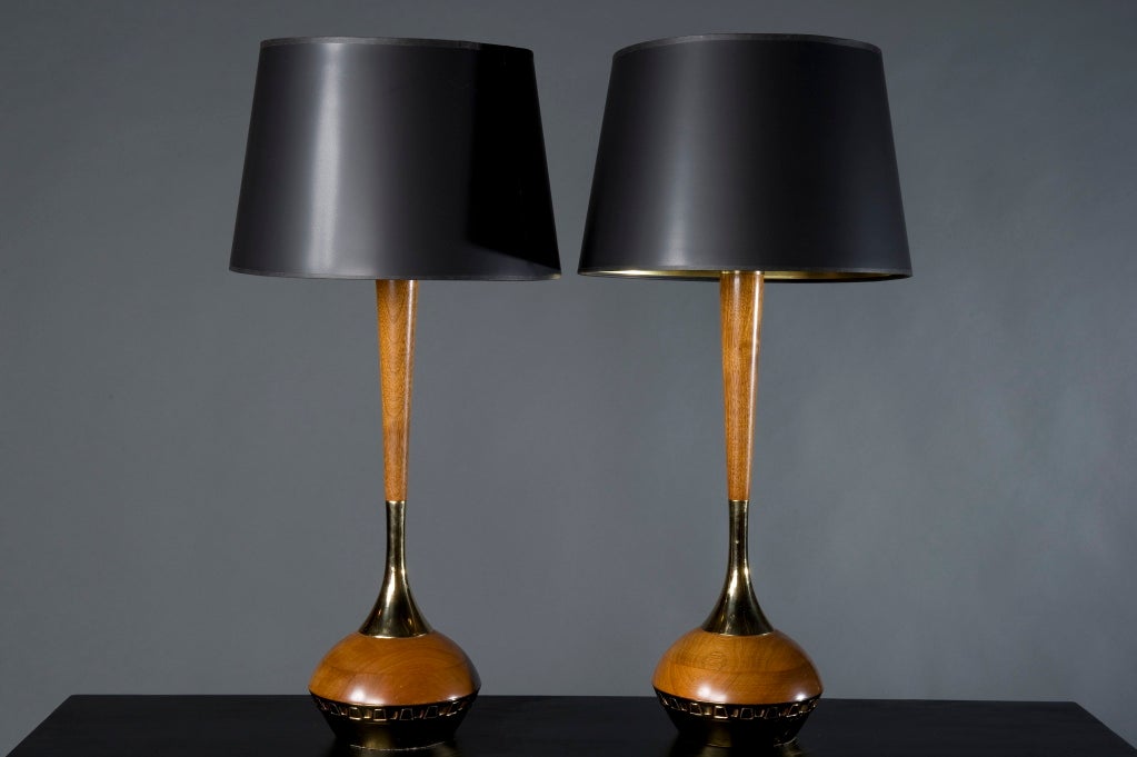 Handsome pair of lamps featuring bright polished brass contrasting with gleaming teak wood. Note distinctive Laurel harp, and original Laurel label on socket.