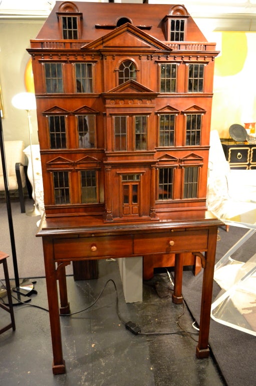 A complete house --and a bar or cabinet. Incredible detail with glass windows, copper mullions and hand carved architectural details. Heavy glass interior shelf. Embossed leather slide. 

This item may be viewed at: The Antique & Artisan Center