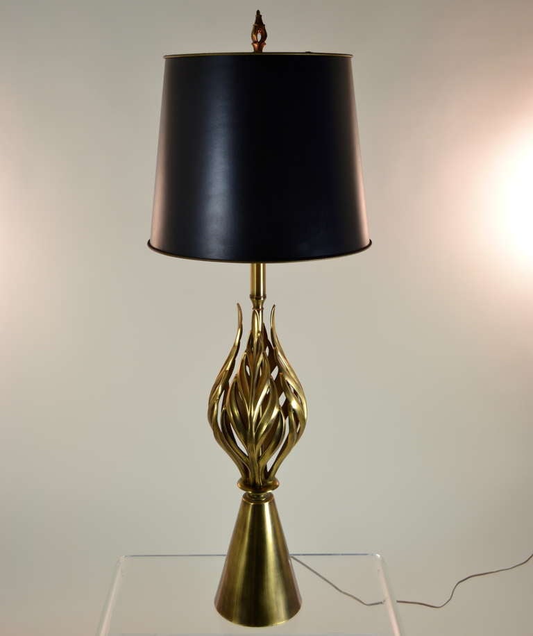 So glam! Finely crafted sculptural lamp with heavy weighted base and original glass globe. Note matching finial. Super quality and great size and presence.
