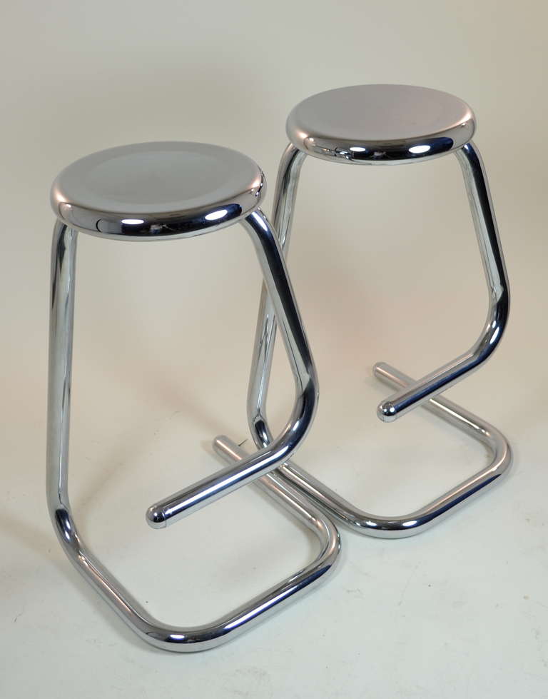 Simple, sculptural form in high-grade polished steel. Surprisingly comfortable. Very stable and sturdy.