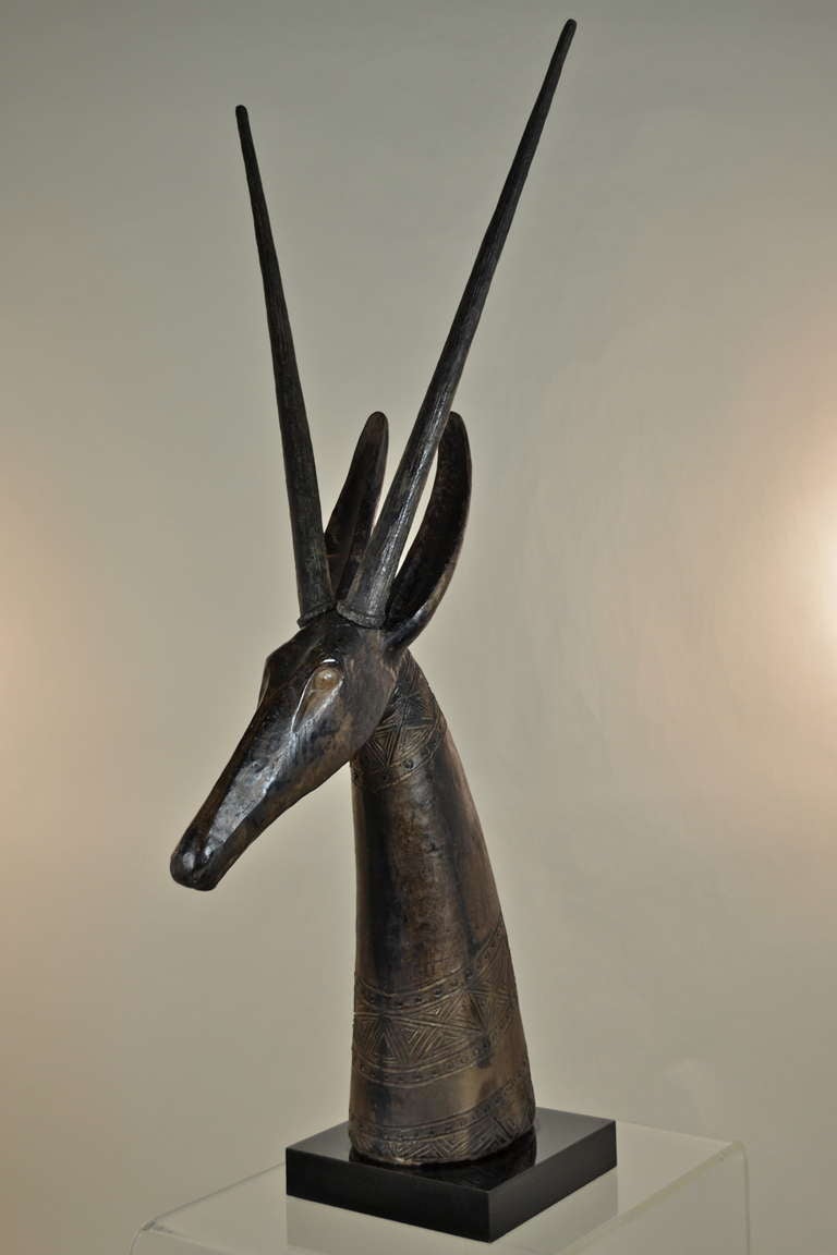 Made of pottery with composite antlers --wonderful African-style antelope sculpture on base. At 48