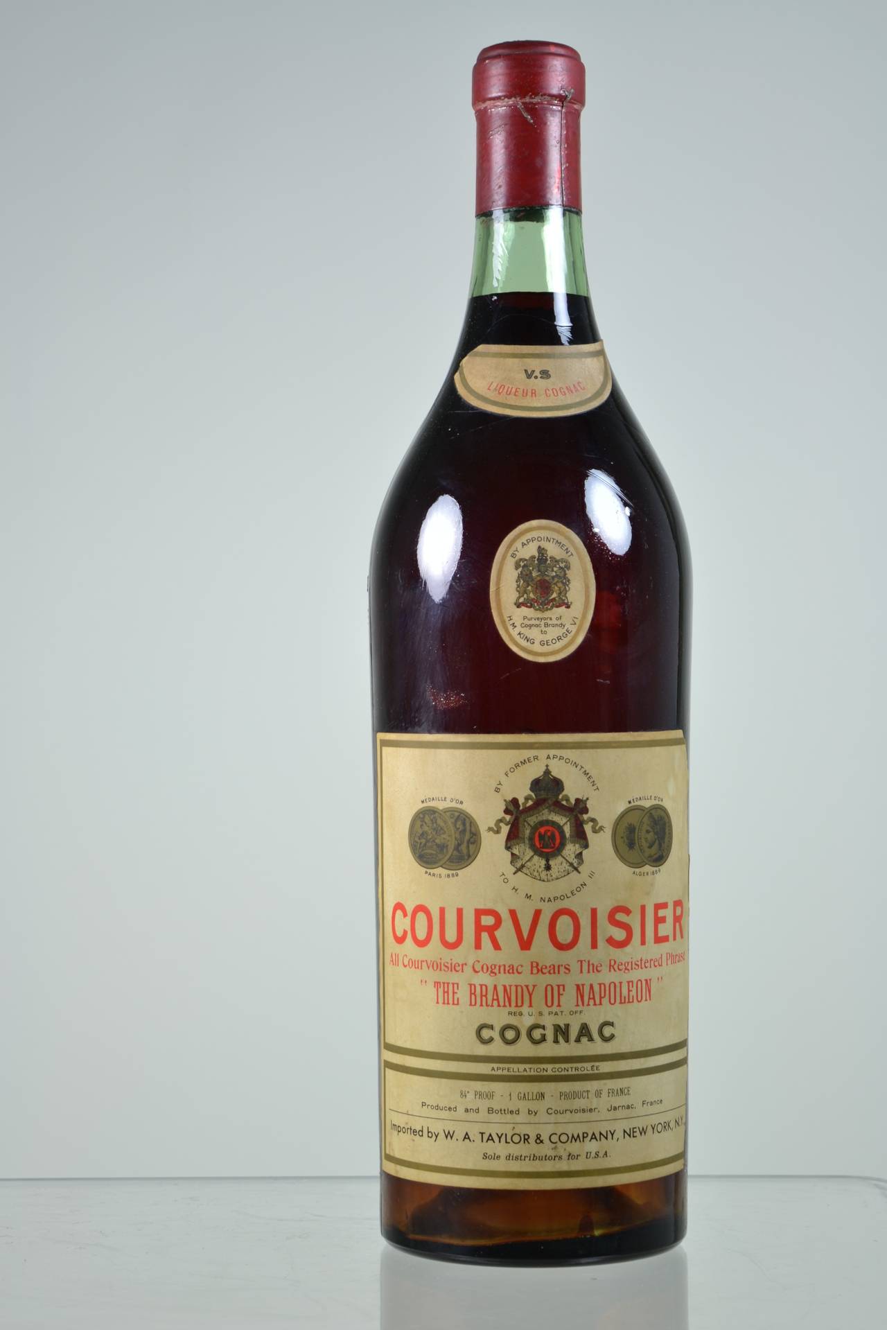 Martell and Courvoisier. Charming display bottles with painted interior to replicate a full bottle. (Sorry but these are empty!). In excellent vintage condition. The Martell bottle measures 6" in diameter and 23" in height; the Courvoisier