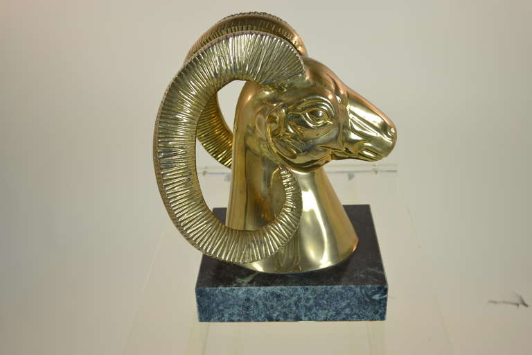 Classic ram's head in solid brass mounted on heavy marble base. Great imposing size.