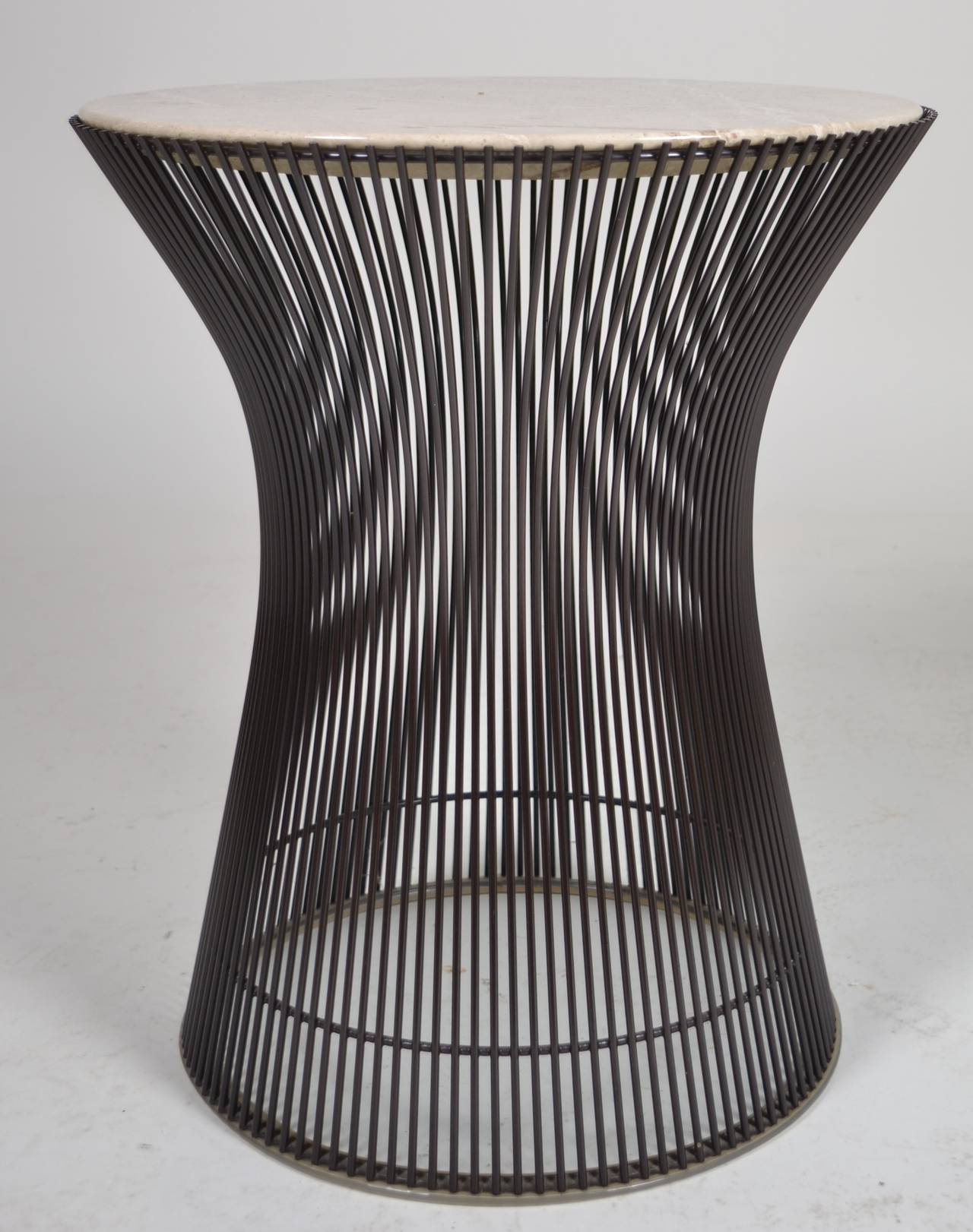 An especially attractive example of the iconic Platner side table. Excellent condition, with dark bronze base and taupe figured, knife edged marble inset into frame. Introduced in 1966, this table was made in the early 1970s.
